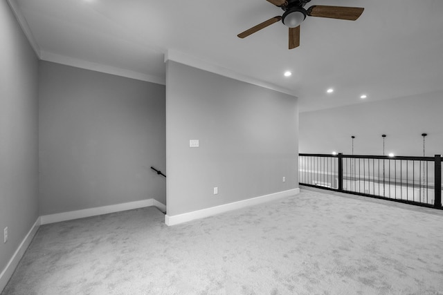 spare room featuring baseboards, ceiling fan, ornamental molding, carpet floors, and recessed lighting