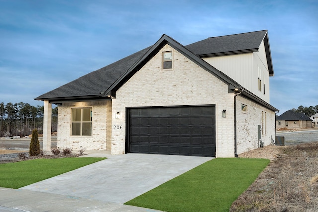 view of front of property featuring central AC unit, concrete driveway, roof with shingles, an attached garage, and brick siding