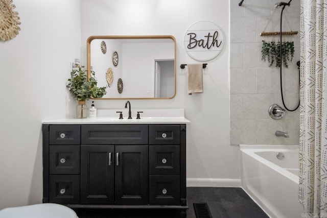 full bathroom featuring visible vents, toilet, shower / bath combo with shower curtain, vanity, and baseboards