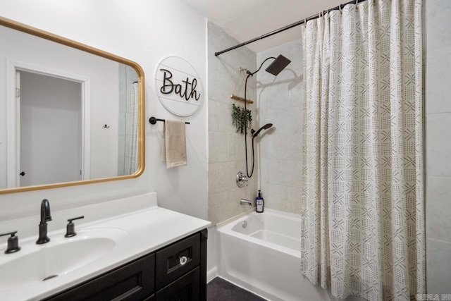 bathroom featuring shower / bathtub combination with curtain and vanity