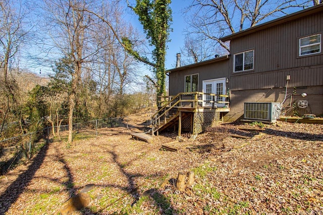 back of house featuring a deck, a fenced backyard, central AC, stairs, and french doors