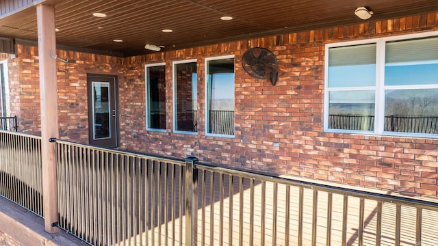 view of property exterior with a garage and brick siding