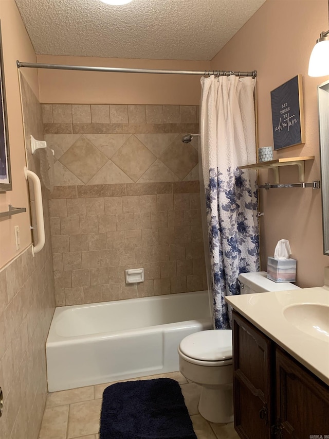 bathroom featuring toilet, shower / tub combo, a textured ceiling, vanity, and tile patterned flooring