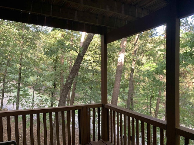 deck featuring a forest view