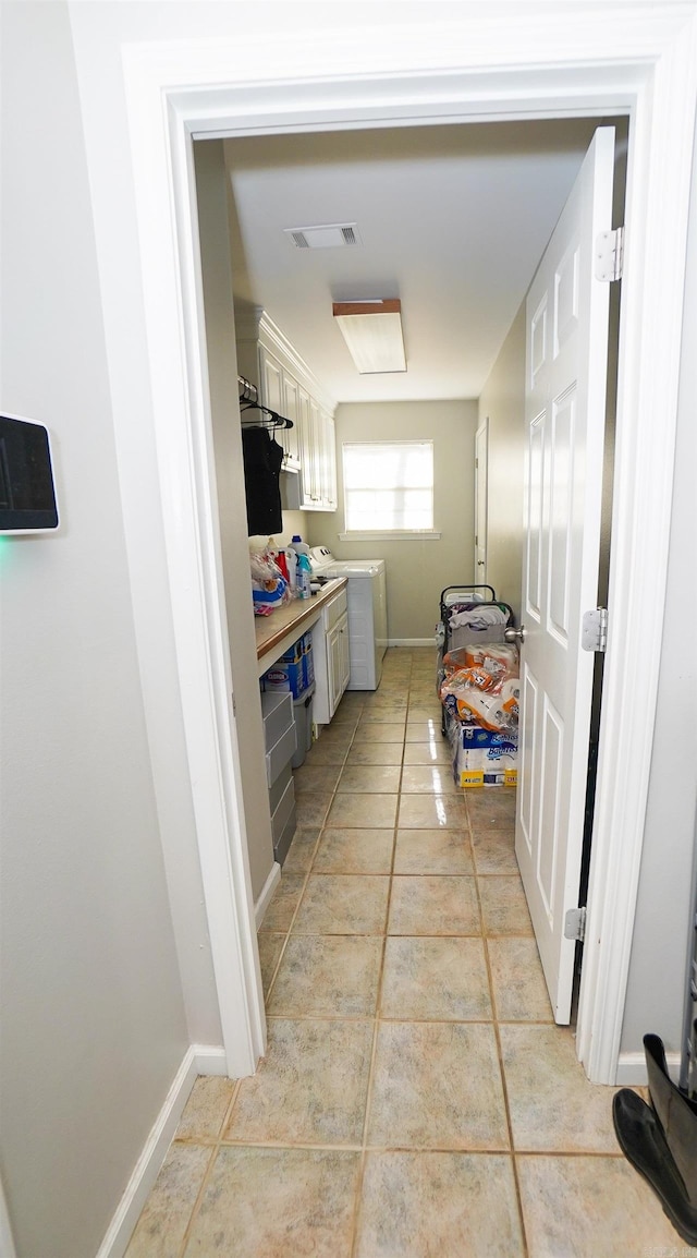 laundry room with washer / dryer, visible vents, baseboards, and light tile patterned flooring