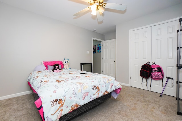 bedroom featuring carpet floors, a closet, baseboards, and a ceiling fan