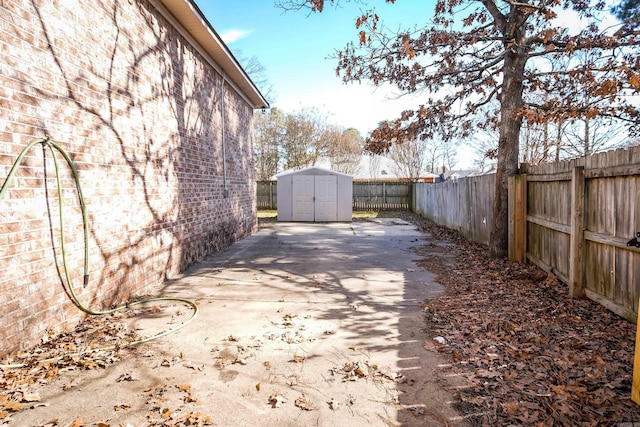 view of street with concrete driveway and a gated entry