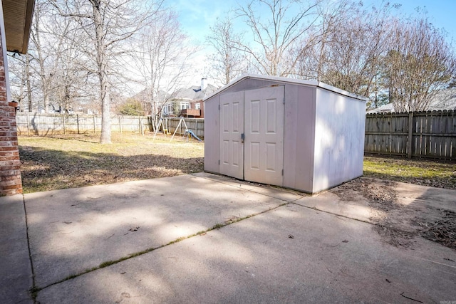 view of shed featuring a fenced backyard