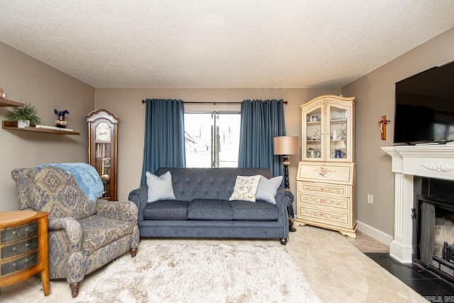 tiled living room featuring a textured ceiling, a fireplace with flush hearth, and baseboards