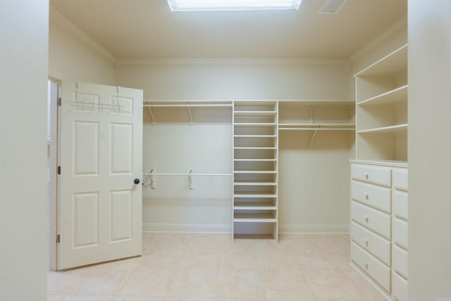 spacious closet with light tile patterned flooring and visible vents