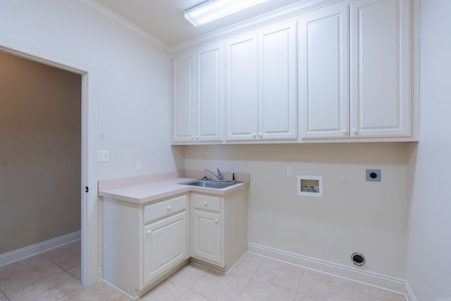laundry area with hookup for an electric dryer, washer hookup, a sink, baseboards, and cabinet space