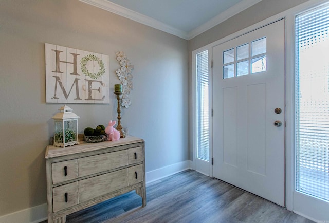 entryway featuring crown molding, baseboards, and wood finished floors