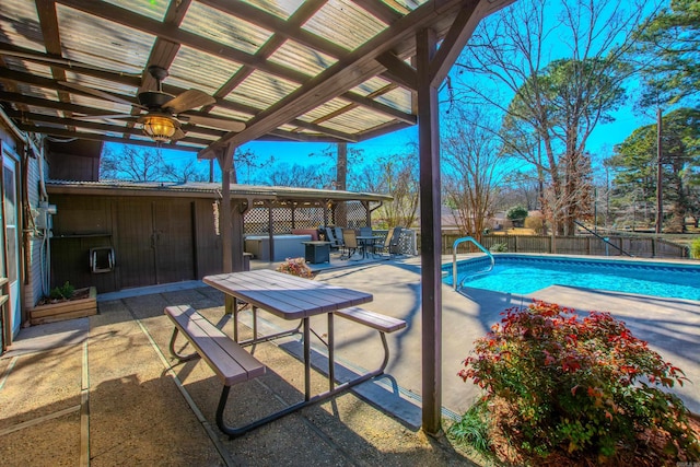 view of pool featuring a ceiling fan, a fenced in pool, a patio, a fenced backyard, and outdoor dining area