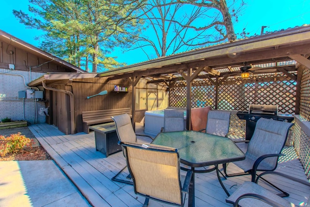 wooden deck featuring outdoor dining space and a grill