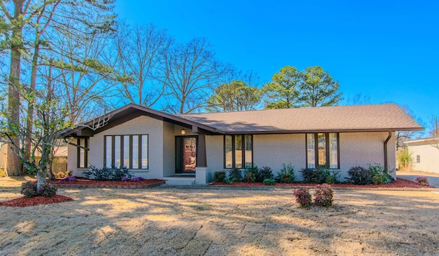 view of front of property featuring brick siding