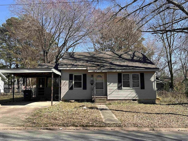 view of front facade with entry steps, concrete driveway, crawl space, and fence