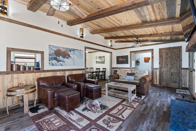 living room featuring lofted ceiling with beams, wooden ceiling, wood finished floors, and a ceiling fan