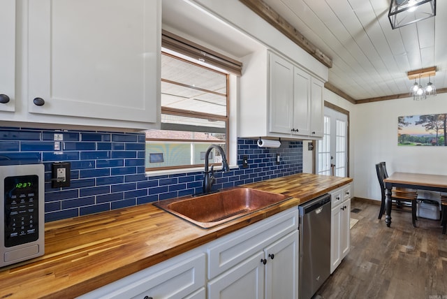 kitchen with dishwasher, a sink, wood counters, and a healthy amount of sunlight