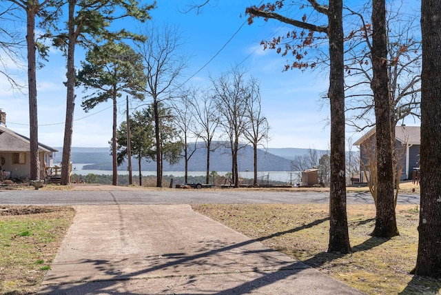 exterior space featuring driveway and a mountain view