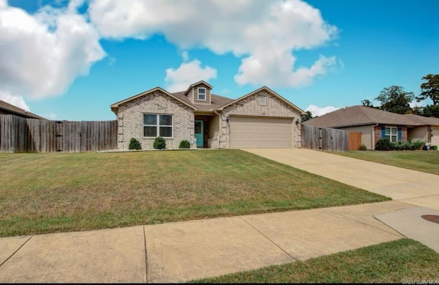 view of front of house featuring a garage, driveway, a front lawn, and fence