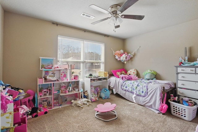 bedroom with ceiling fan, carpet floors, and visible vents