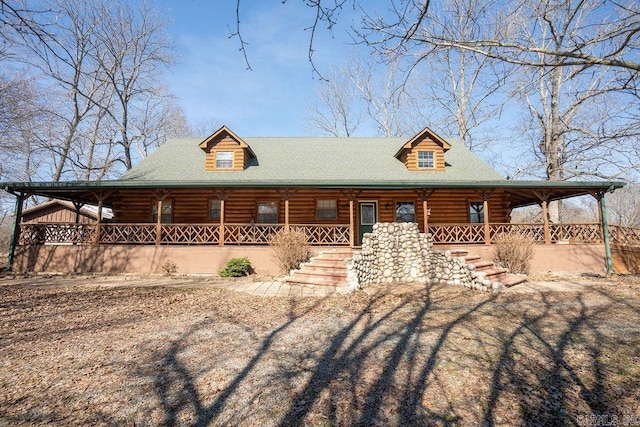 log home with covered porch