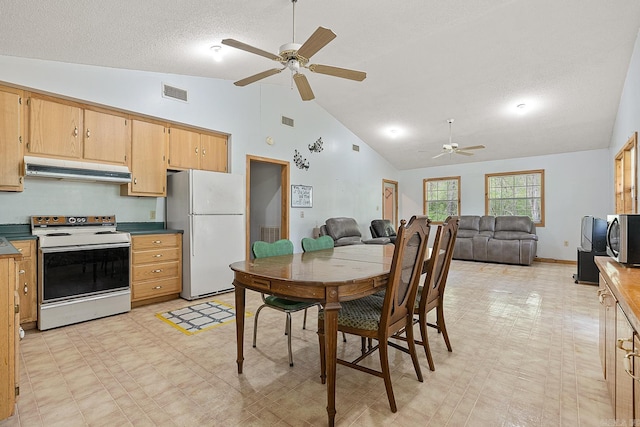 kitchen featuring white appliances, under cabinet range hood, visible vents, and light floors