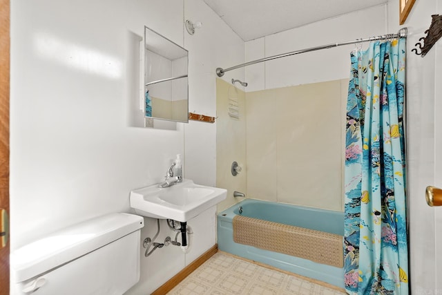 full bathroom featuring toilet, shower / bathtub combination with curtain, a sink, and tile patterned floors