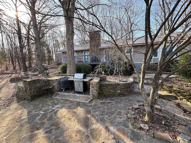 view of patio / terrace with stairway and a wooden deck