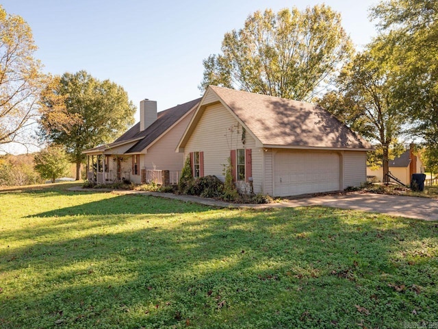 view of home's exterior with a garage, a chimney, and a lawn