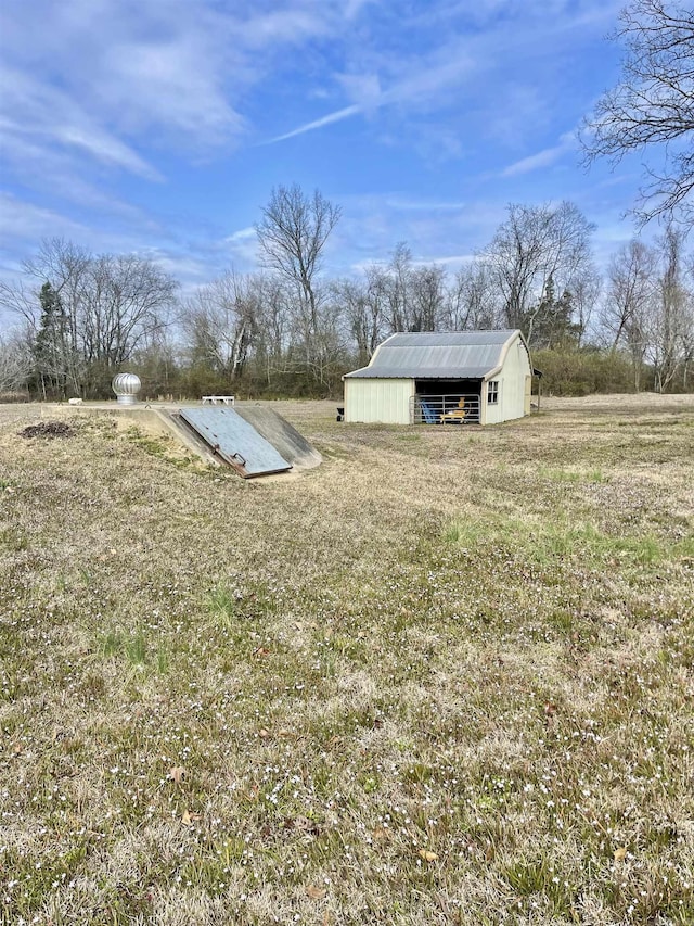 entry to storm shelter with an outbuilding and a yard