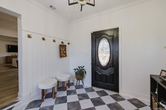 foyer entrance featuring baseboards, visible vents, crown molding, and tile patterned floors