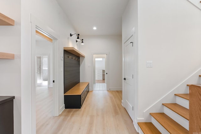 mudroom with baseboards, light wood finished floors, and recessed lighting