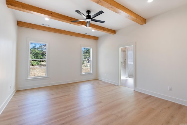 unfurnished room featuring light wood-type flooring, a wealth of natural light, and visible vents