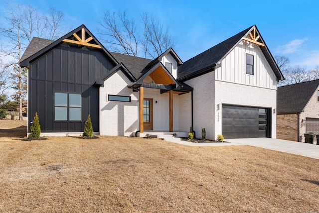 modern farmhouse style home featuring an attached garage, brick siding, driveway, roof with shingles, and board and batten siding