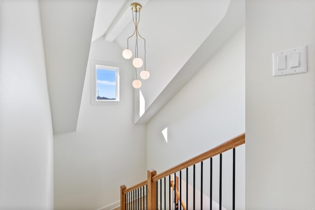 interior space featuring lofted ceiling with beams