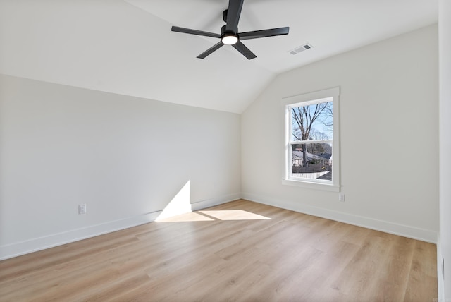 bonus room with light wood finished floors, baseboards, visible vents, a ceiling fan, and vaulted ceiling