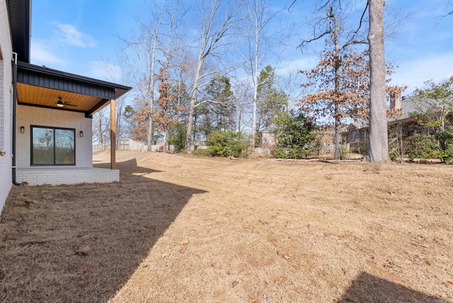 view of yard with ceiling fan