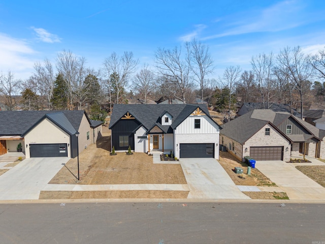 modern farmhouse with a shingled roof, a residential view, board and batten siding, and concrete driveway