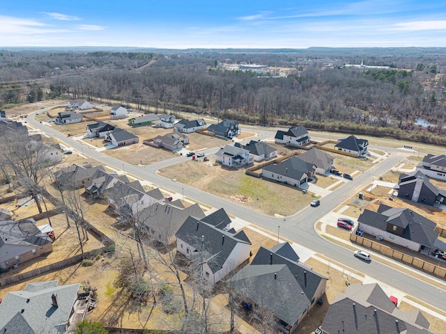 bird's eye view with a residential view and a wooded view