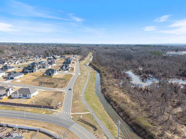 birds eye view of property featuring a residential view and a forest view