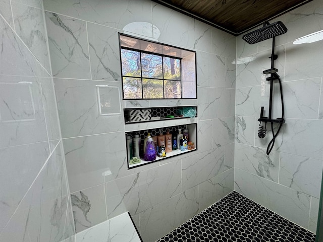 bathroom with tiled shower