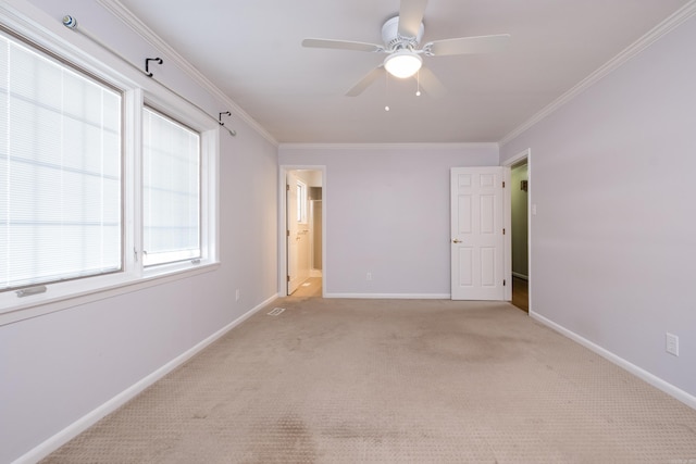 unfurnished bedroom featuring ornamental molding, light carpet, connected bathroom, and baseboards