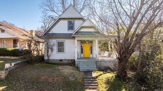 view of front of property with crawl space, covered porch, and roof with shingles