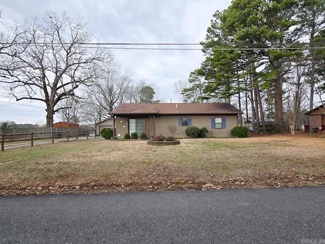 view of front of house featuring fence