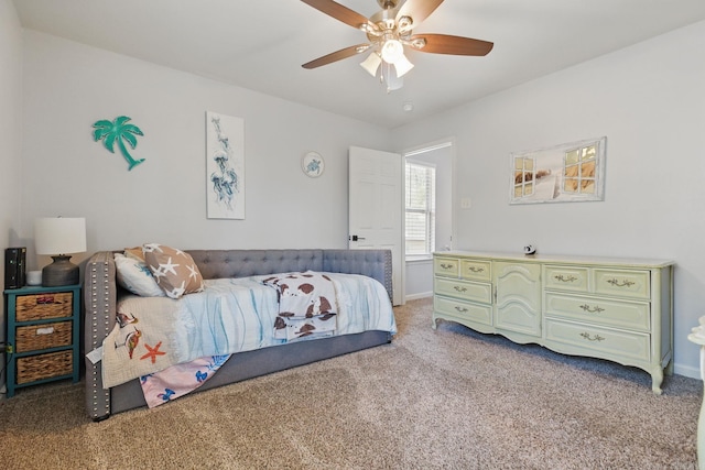 bedroom featuring baseboards, a ceiling fan, and light colored carpet