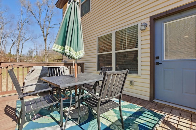 wooden deck with outdoor dining area