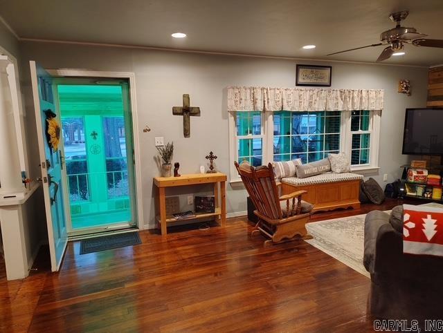 sitting room featuring crown molding, a ceiling fan, wood finished floors, and recessed lighting