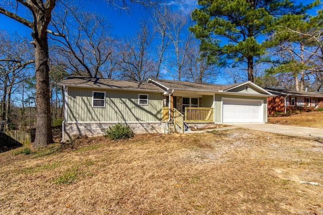 single story home featuring concrete driveway, a porch, and an attached garage