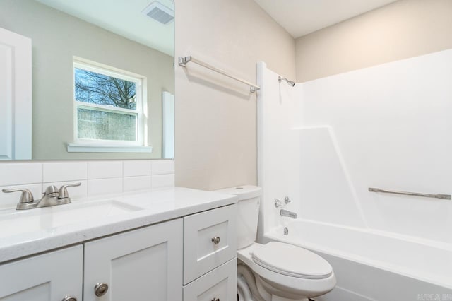 full bathroom with bathing tub / shower combination, visible vents, decorative backsplash, toilet, and vanity